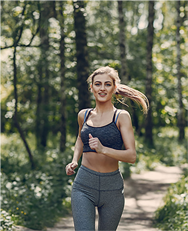 Female coach running down path